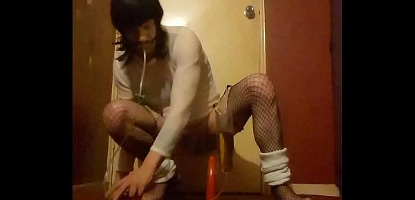  crossdressing sissy rides a dildo while drinking his own piss